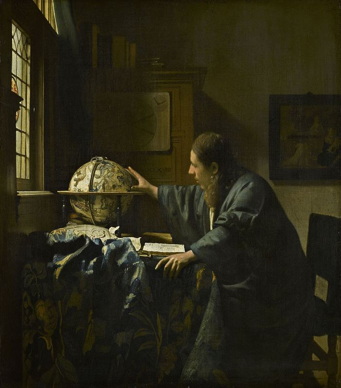 Un astrónomo solo en su estudio, la mano sobre un globo celeste, junto a la ventana — Johannes Vermeer. Dominio público.